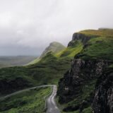 concrete road between mountains