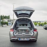 a car with its trunk open in a parking lot