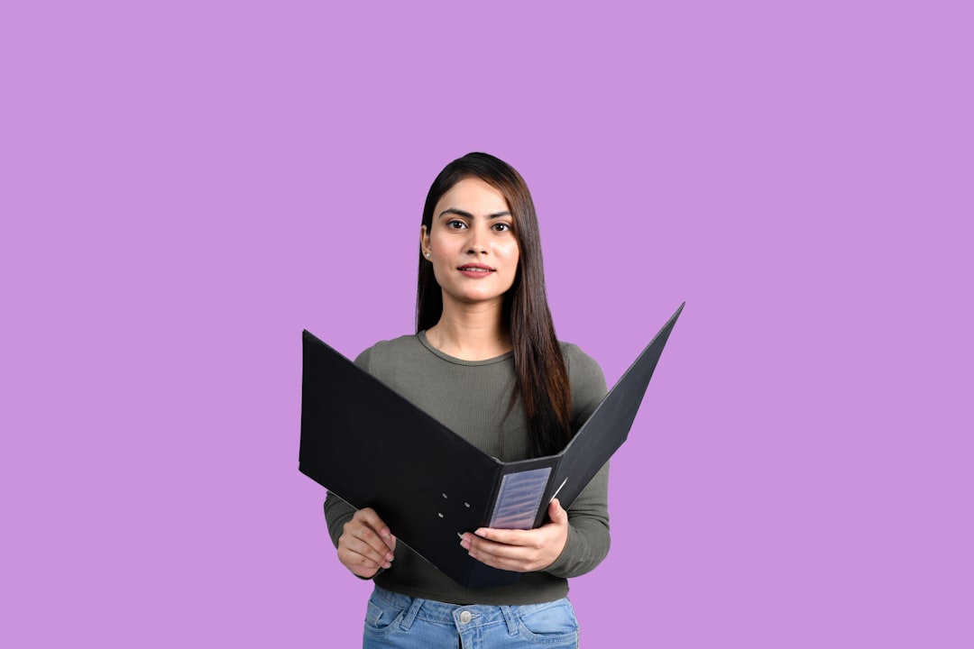 a woman holding a laptop