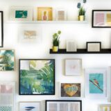 assorted-color framed paintings on the wall