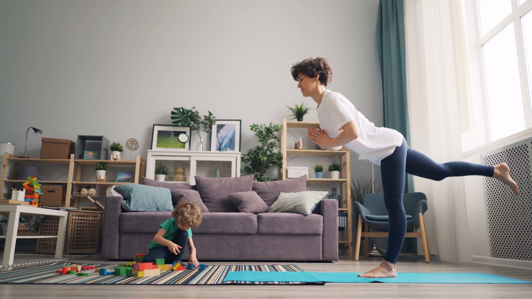 a woman and a child playing in a living room