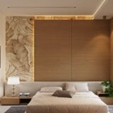 Modern bedroom with a large bed, textured wall, and window