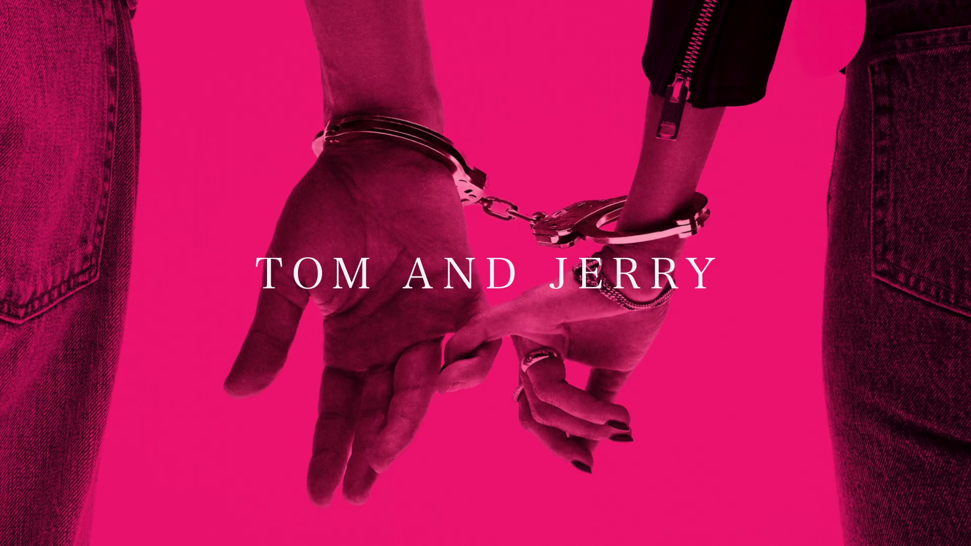 Roze hoes van de single Tom and Jerry van John Mayer met twee handen in handboeien